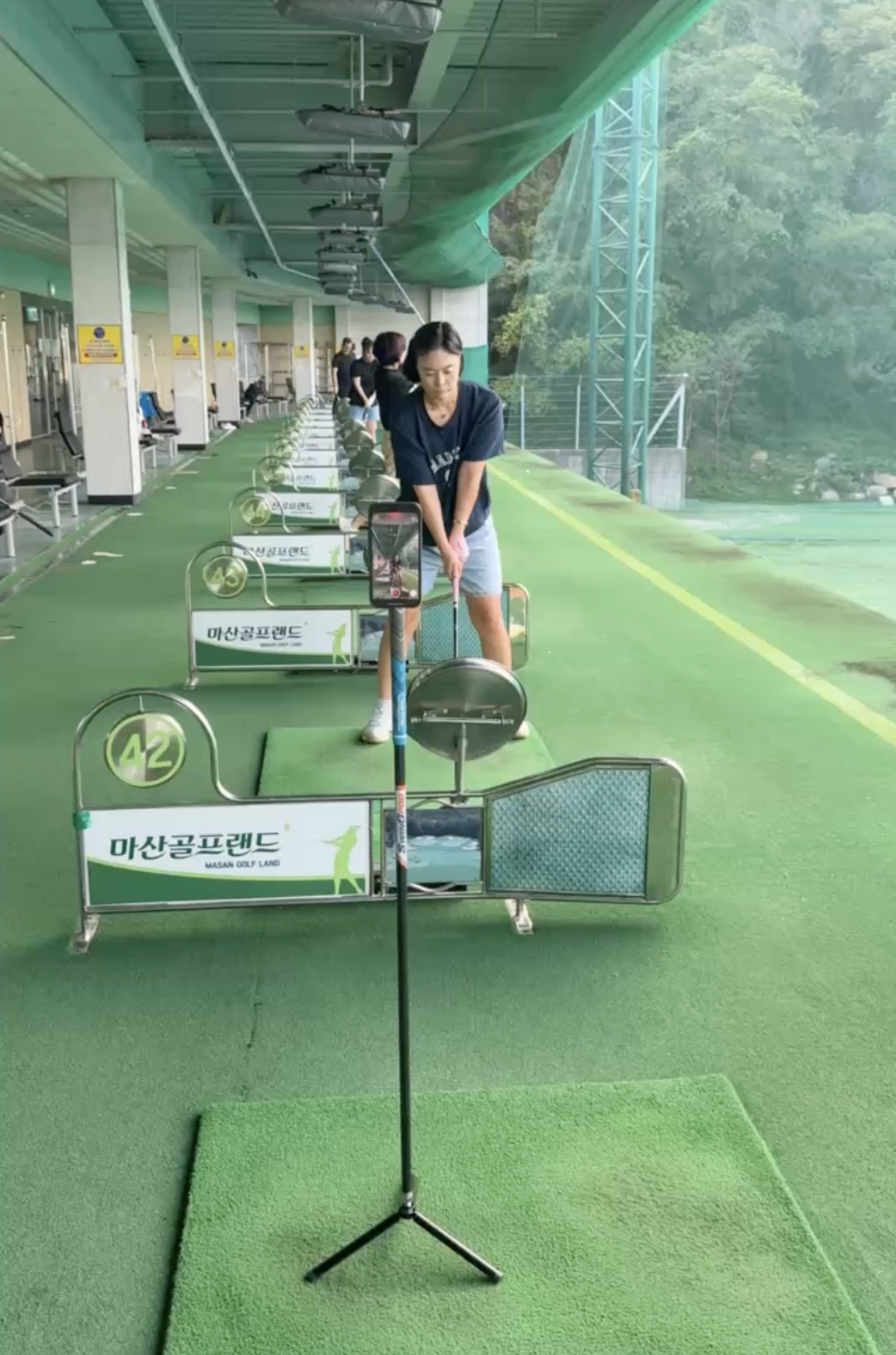 Indoor filming mode — Swingpod on tripod at a driving range